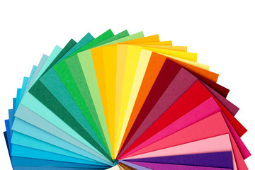 A set of multi-colored sheets laid out in a circle in the form of a fan. Isolated on white background