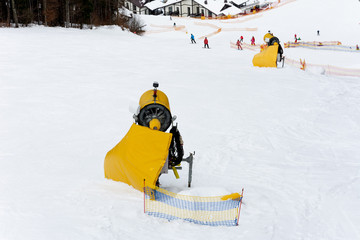 On the slopes, people go skiing enjoying the beauty of the Carpathians.