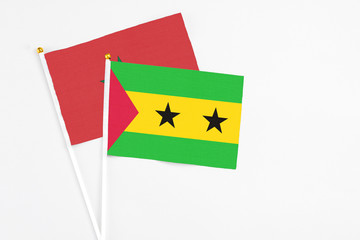 Sao Tome And Principe and Morocco stick flags on white background. High quality fabric, miniature...