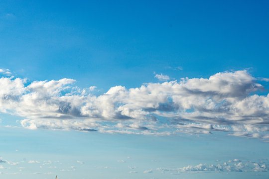 Sky scapes of billowy clouds and blue skies background and wallpaper or sky replacements