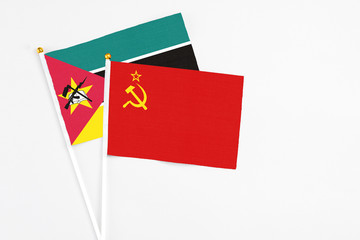 Soviet Union and Mozambique stick flags on white background. High quality fabric, miniature...
