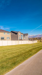Vertical Walled properties overlooking an urban park during day