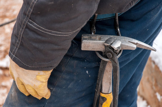 Tool on the belt of the worker for quick work.