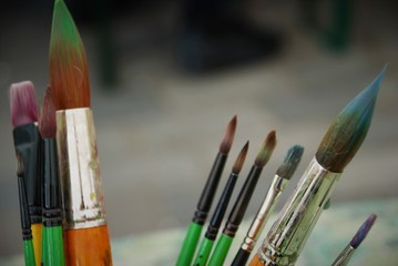 standing brushes in a glass