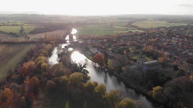Stratford-Upon-Avon Cotswolds English Town, Aerial Drone View, River Avon Weir, Holy Trinity Church On Sunny Autumn Day
