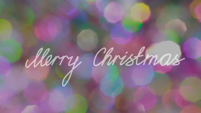 "Merry Christmas" Text agaist Glowing Bokeh Backround