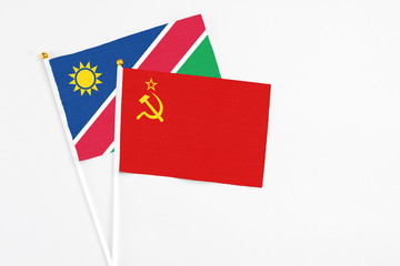 Soviet Union and Namibia stick flags on white background. High quality fabric, miniature national flag. Peaceful global concept.White floor for copy space.