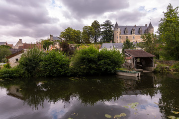 Obraz premium The beautiful village of Montresor bathed by the Indrois river, located in the Loire Valley.