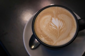 cup of coffee on black background
