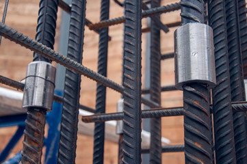 The method of connecting reinforcing bars for concrete work at a construction site.
