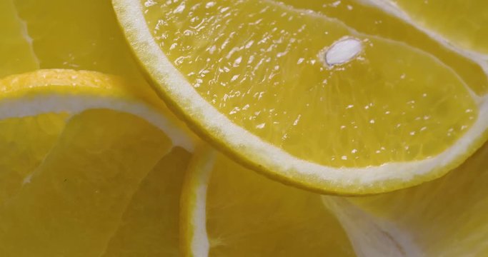 Fresh sliced orange rotating on white surface. Close up of vitamin detox fruit.  4k food isolated.