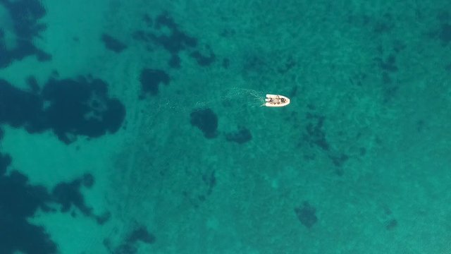 Aerial view of single speed boat floating over transparent water, Croatia.