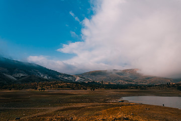 mountain cloud sun and tree lake views