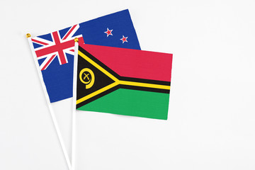 Vanuatu and New Zealand stick flags on white background. High quality fabric, miniature national...