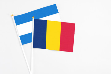 Chad and Nicaragua stick flags on white background. High quality fabric, miniature national flag....