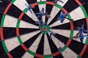 Dart board with darts closeup