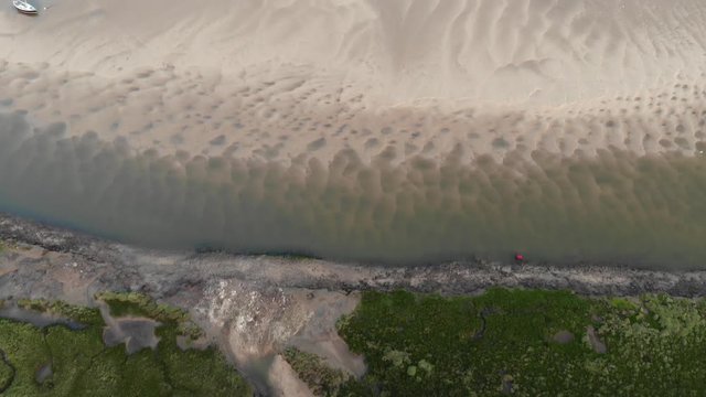 Bird's Eye View Of Boats Stranded On Sandbar, Tidal Estuary, Low Tide, Aerial Landscape