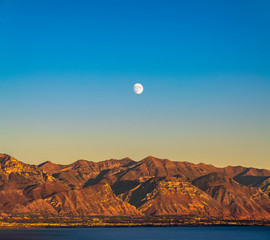Moonrise over the rugged mountains in Provo Canyon
