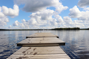 Water splashing at the end of a pier at Lake Ranuanjarvi in Finland