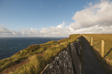 Path of Cliffs of Moher with cloudscape