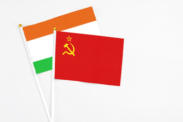 Soviet Union and Niger stick flags on white background. High quality fabric, miniature national flag. Peaceful global concept.White floor for copy space.