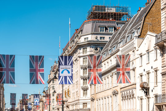 London, UK - June 22, 2018: Nobody on Regent street road in Piccadilly Soho hanging flags banners decorations and union jack flags