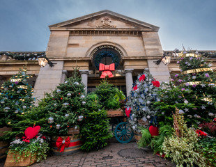 Christmas scene outdoor with tree decorations in the town square market of Covent Garden in London, in winter holiday
