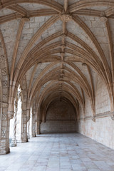 Fototapeta na wymiar Archways in an old monastery in Portugal, vertical 