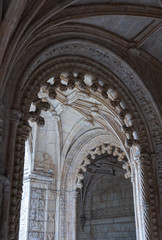 Archways in an old monastery in Portugal,vertical