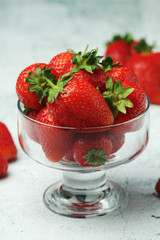 A bowl with ripe bright strawberry