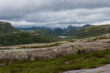 Fototapeta premium Mountains on the way to the Preachers Pulpit Rock in fjord Lysefjord - Norway - nature and travel background. Lake Tjodnane, july 2019