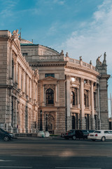 Fototapeta na wymiar Facade of Burgtheater in Vienna with sunset golden cast