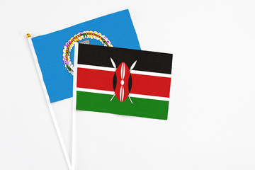 Kenya and Northern Mariana Islands stick flags on white background. High quality fabric, miniature national flag. Peaceful global concept.White floor for copy space.