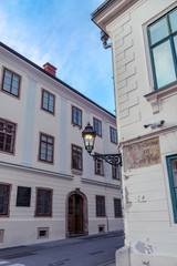 Obraz premium Lantern on the wall of an old house, Upper town, Zagreb, Croatia