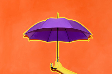 Fototapeta na wymiar A man holds in his hand a purple umbrella on a background of an orange wall. Concept autumn, business, art.