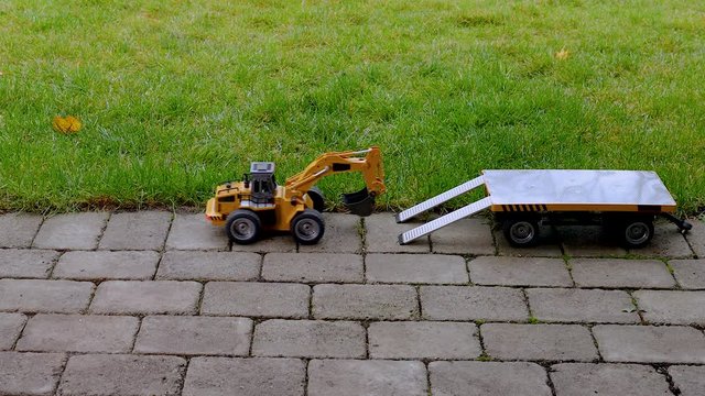 View of radio controlled model  dump truck and trailer Free time. Children and adults concept. Hobby. Toys. 