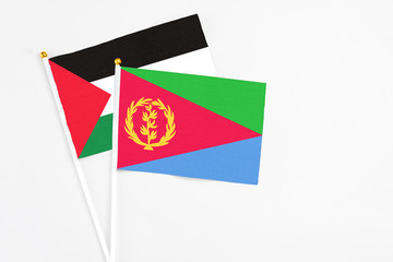 Eritrea and Palestine stick flags on white background. High quality fabric, miniature national...