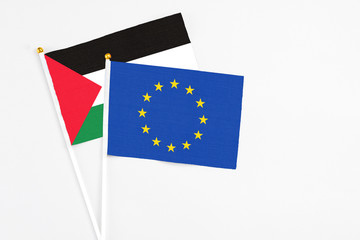 European Union and Palestine stick flags on white background. High quality fabric, miniature...