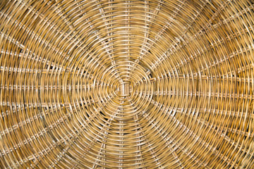 Rattan anthracite beautiful relief braided in a circle of yellow brown. Backgrounds, structures, design.