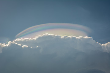 The cloud iridescence or irisation, colorful optical phenomenon that occurs in a cloud due to...