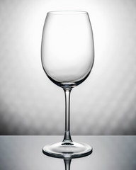 Transparent empty wineglass isolated, object photography.