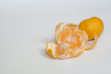 Orange Mandarines, Clementines, Tangerines with one peeled and cut in half with leaves isolated on...