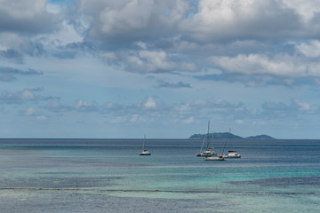 Beautiful view to catamaran boat in Seychelles bay, travel to a tropical island and boat tour concept