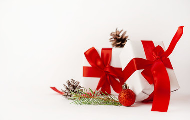 Christmas card with a Christmas tree and gifts on a white background. with a place for congratulations.