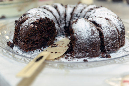 Chocolate Bundt Cake Is More Inviting With One Of The Slices Already Missing.