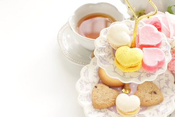 Heart shaped candy and cookie for afternoon tea image