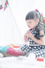 Fototapeta premium Merry christmas happy little child with beautifully decorated christmas tree holidays in home, christmas concept