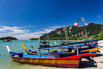 Squid fishing boats on the beach by Telaga Harbor on Langkawi island, also known as Pulau Langkawi, Andaman Sea, State of Kedah, Malaysia.