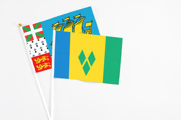 Saint Vincent And The Grenadines and Saint Pierre And Miquelon stick flags on white background....