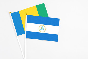 Nicaragua and Saint Vincent And The Grenadines stick flags on white background. High quality...